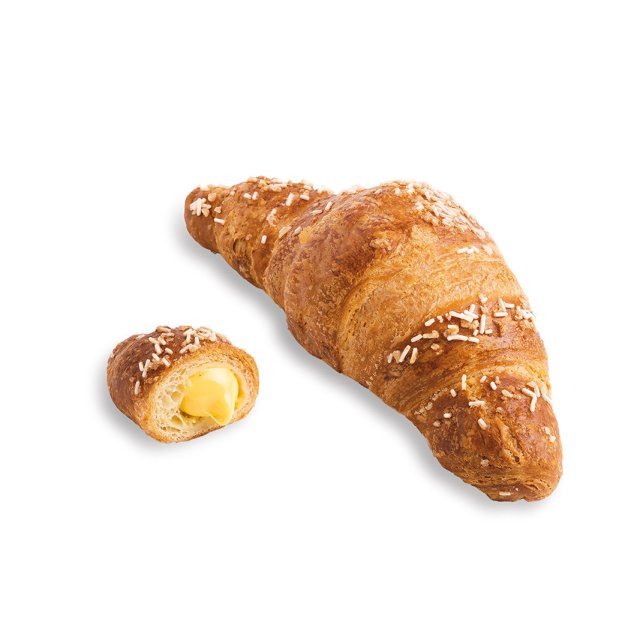 Croissant auriu cu stropi albi, alături o bucată tăiată cu umplutură cremoasă galbenă.
