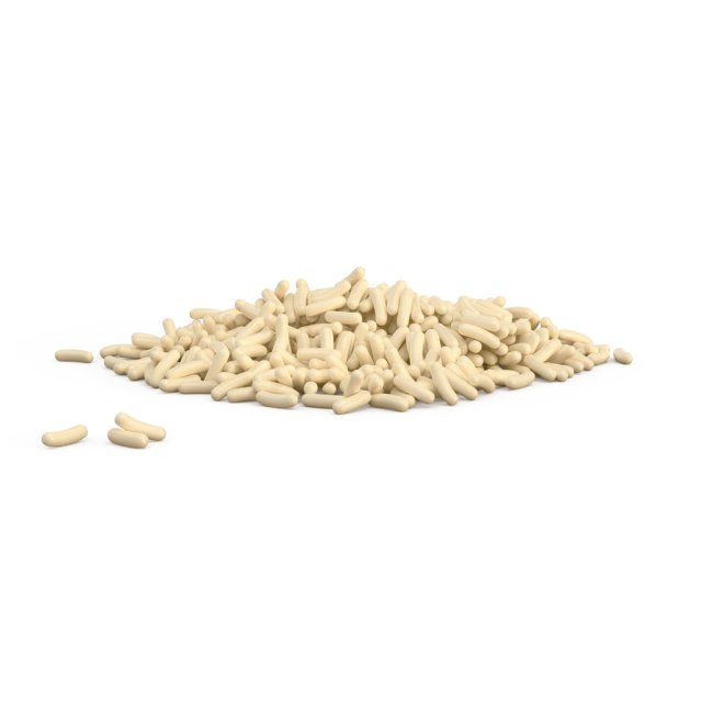 O grămadă mică de granule cilindrice crem pe fundal alb, cu câteva bucăți împrăștiate alături.
