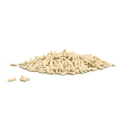 O grămadă mică de granule cilindrice crem pe fundal alb, cu câteva bucăți împrăștiate alături.